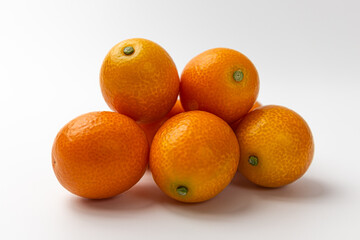 Kumquats on a white background