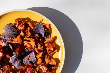 Organic vegetable chips. Close-up of orange and red carrot and beet chips on a plate.