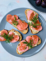 Sandwiches with meat sausage and dill