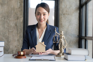 Real estate concept, businesswoman holding a house icon. House on Hand.Property insurance and security concept. Protecting gesture of female and symbol of house..