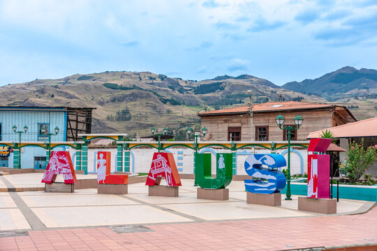 Alausi, Ecuador - September 24, 2022: the name of the city from the letters on the square