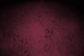 Black concrete wall wide texture, dark background. Viva Magenta color of the year 2023