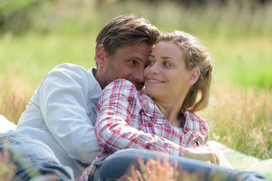 picture of couple hugging on the grass
