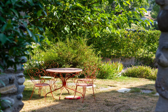 Set outdoor dining furniture in the beautiful countryside garden.