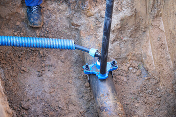 Construction worker, repairing a broken water pipe
Construction site with new Water Pipes in the...
