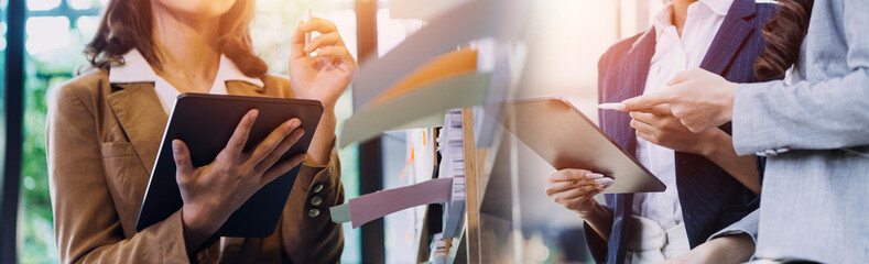 Businessman and team analyzing financial statement Finance task. with smart phone and laptop and tablet. Wealth management concept