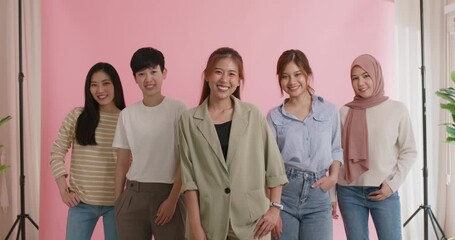 Group of young people Gen Z talent workforce relax smile look at camera standing studio shot shooting. Power of diverse asia girl woman, youth LGBT pride gay lesbian, female lady unity in women's day.
