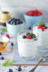 Greek yogurt in glasses with berries and quinoa	