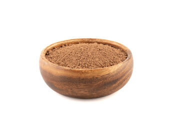 Wooden bowl full of cocoa powder isolated on white background.