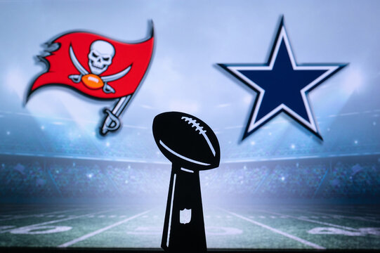 TAMPA BAY, USA, JANUARY 10, 2023: Dallas Cowboys vs. Tampa Bay Buccaneers. NFL Wild Card Round 2023, Silhouette of Vince Lombardi Trophy for the winner of National Football League. Big screen