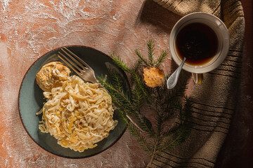 Breakfast on the table. Food and napkin on a dark background. Abstract backdrop