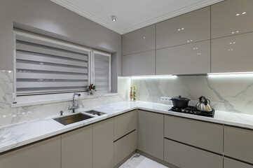 Fototapeta na wymiar Luxury white modern marble kitchen in studio space