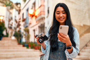 Asian female tourist student on city streets