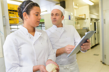 upset baker showing the kitchen of the bakery