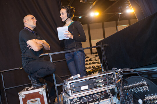 stage crew by sound equipment