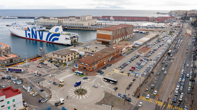 Naples, Italy - January 2023: GNV ferry is anchored in the harbor of the city. This ferry is ready to embark cars and people and set sail on the Mediterranean sea on a sunny day.