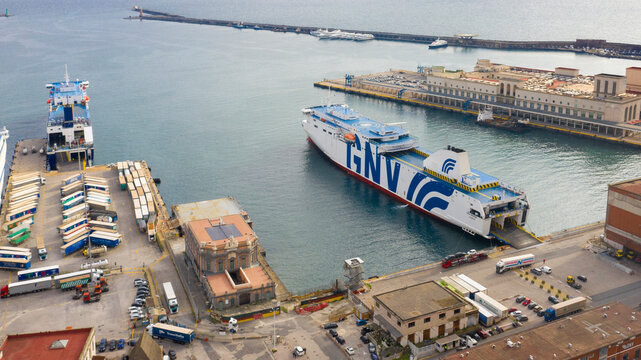 Naples, Italy - January 2023: GNV ferry is anchored in the harbor of the city. This ferry is ready to embark cars and people and set sail on the Mediterranean sea on a sunny day.