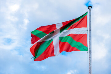 Basque country flag waving against a sky.