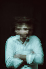 schizophrenic blurred portrait of psychopathic man with mental disorders and disorders on dark...