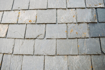Detail of slate tiles on a medieval roof, a traditional way of insulating houses.