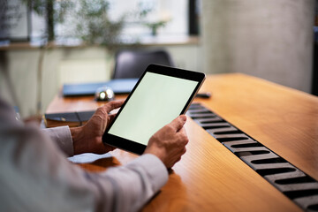 Close up of man using digital tablet