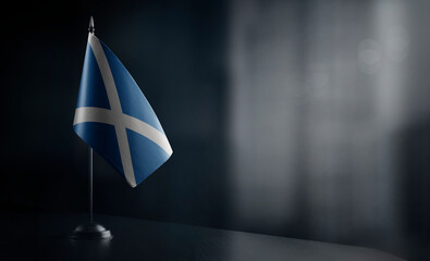 Small national flag of the Scotland on a black background