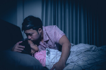 Fototapeta premium Dad and daughter sleep on the bed in bedroom,Watch cartoon with phone,Father day concept,Single dad,listen tale before sleep