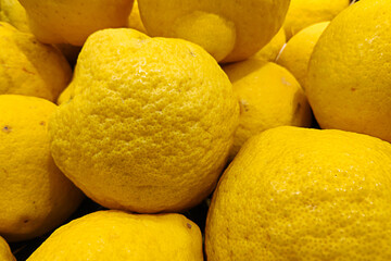 Stack of citrons on a market stall