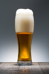 Cold Craft light Beer in a glass. Close up of a pint of beer