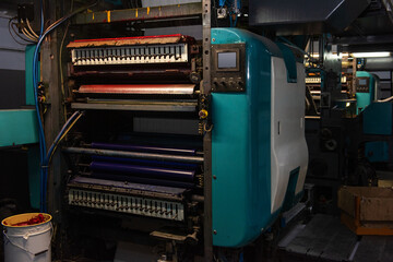 Printing house warehouse interior with printing machine