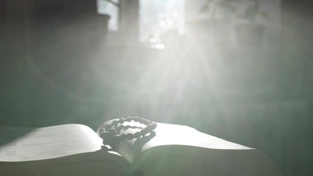 Light falls on the holy bible. Feeling the presence of God