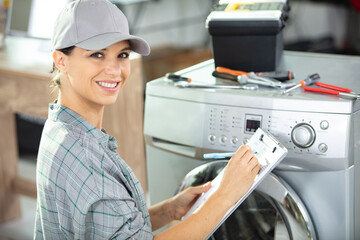 young woman washing machine repair service