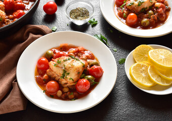 Cod stew with chickpeas, cherry tomatoes and olives