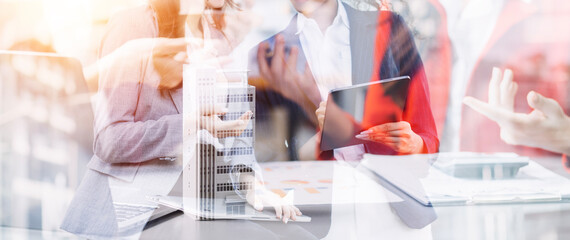 Businessman and team analyzing financial statement Finance task. with smart phone and laptop and...