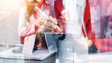 Businessman and team analyzing financial statement Finance task. with smart phone and laptop and...