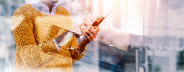 Businessman and team analyzing financial statement Finance task. with smart phone and laptop and...