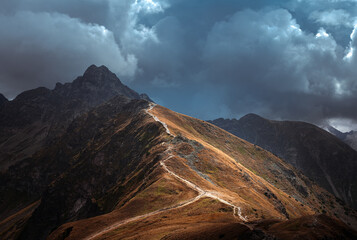 Breathtaking views over the valley of impressive Tatra mountains in misty weather. National park in...