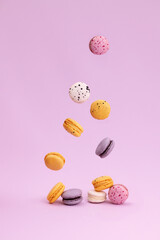 Sweet colorful macarons falling down