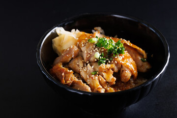 Grilled Chicken teriyaki rice Japanese food isolated in black background