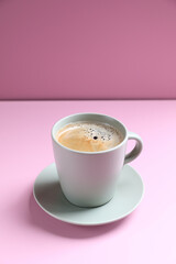 Black coffee white cup isolated on pink background