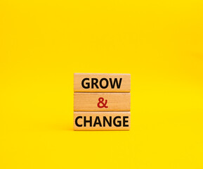 Naklejka premium Grow and Change symbol. Concept word Grow and Change on wooden blocks. Beautiful yellow background. Business and Grow and Change concept. Copy space