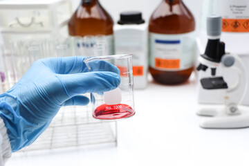 Red chemical in glass , chemical in the laboratory and industry