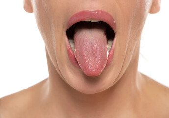  Woman showing tongue on white background. Close up, front view