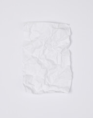 White crumpled sheets of paper on a white background