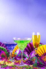 Mardi gras cocktails set. Colorful purple, yellow, green martini champagne wine cocktail glasses...