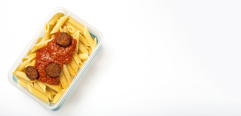 Macaroni with tomato sauce, chorizo and cheese in plastic container