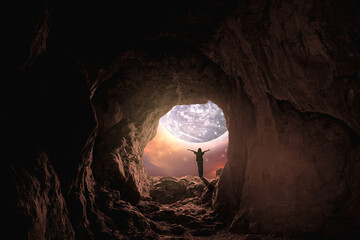 Success. A young girl stands on a mountain cave enjoying the scenery. young girl enjoying freedom the spirit of the fantasy world