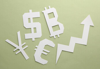 Different paper cut currency icons with growth arrow on green background