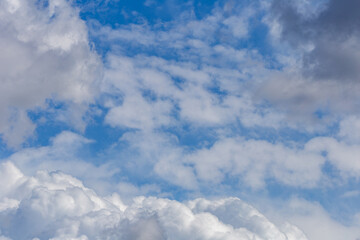 Cumulus cloud formations with a blue sky.