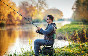 Fisherman angling on the river. Sport and recreation concept